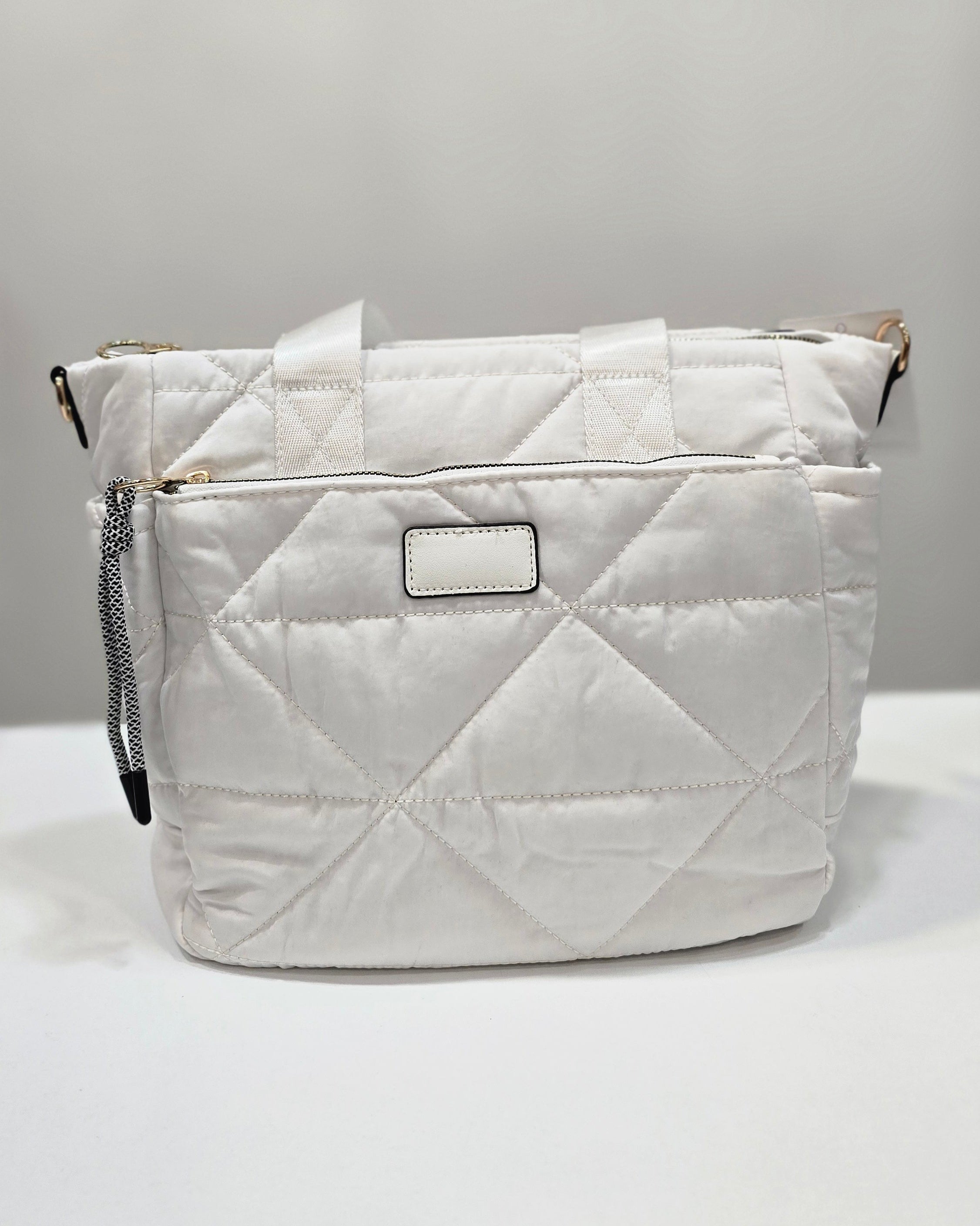 Bolso grande de tela acolchado